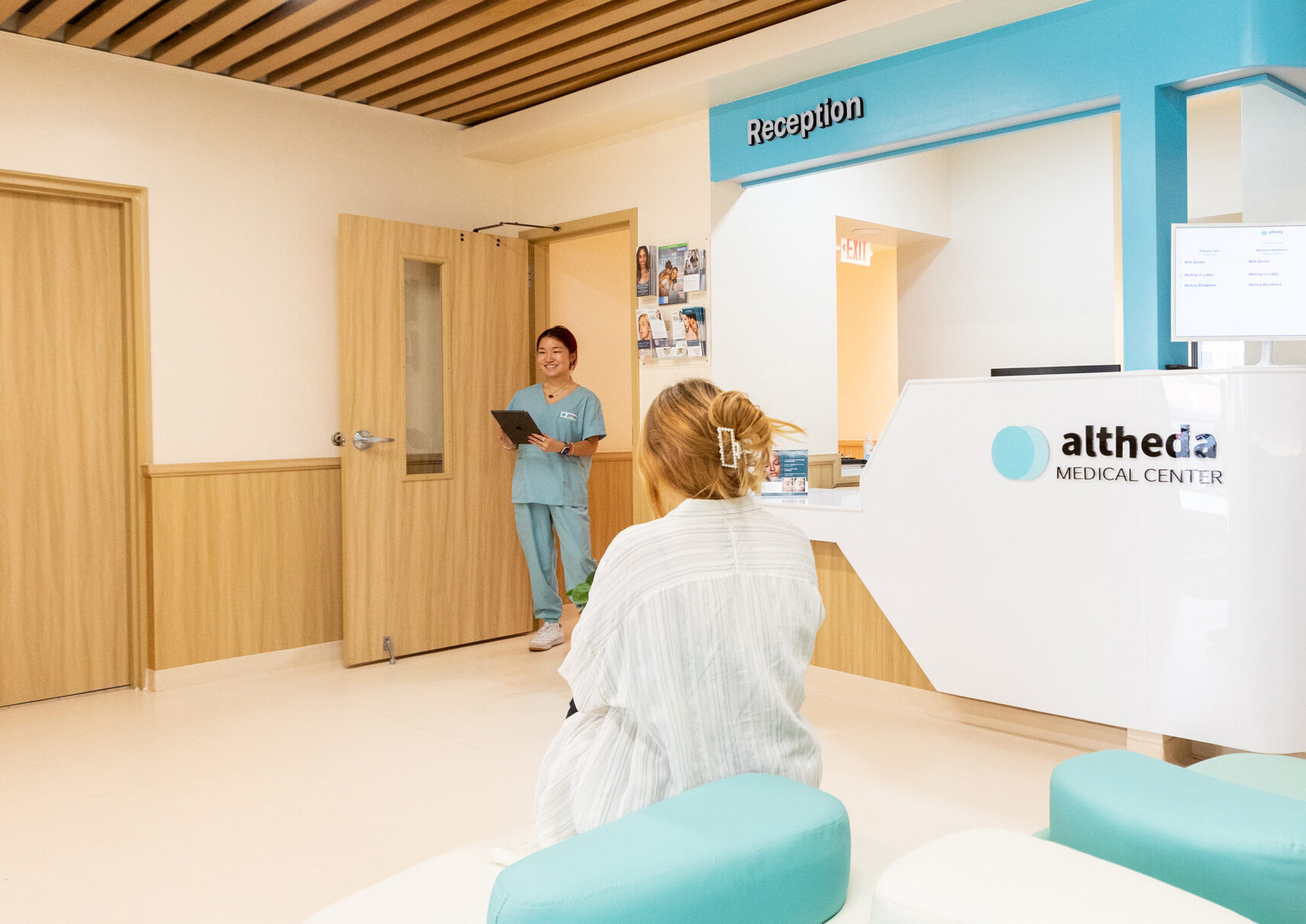 Patient checking in at Altheda Medical Center reception for annual physical