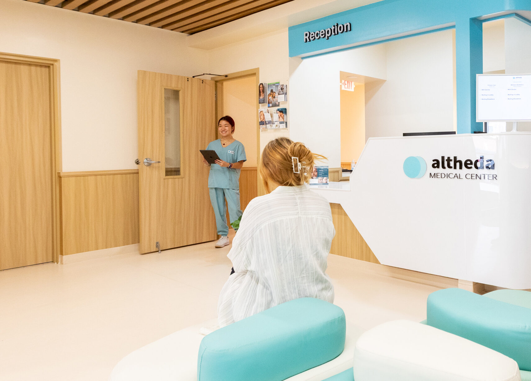 Patient checking in at Altheda Medical Center reception for a Pap smear appointment in Pittsburgh
