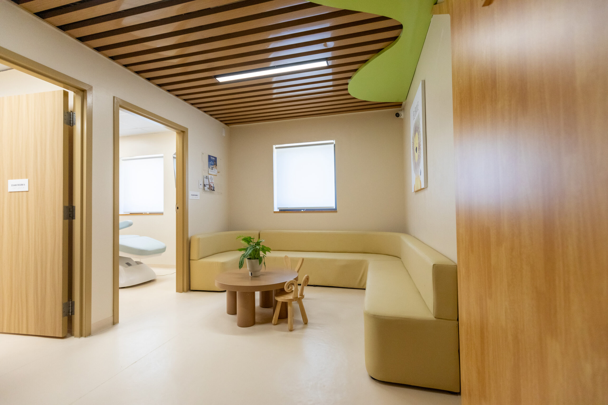 Family-friendly seating area and exam room corridor inside Altheda Medical Center