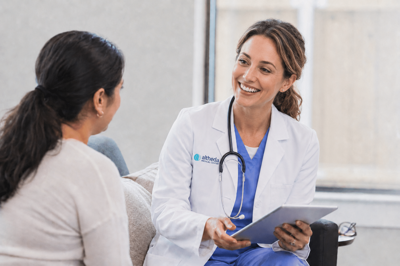Provider speaking with a patient during a confidential women’s health visit for painful periods or menstrual pain at Altheda Medical Center near Pittsburgh.